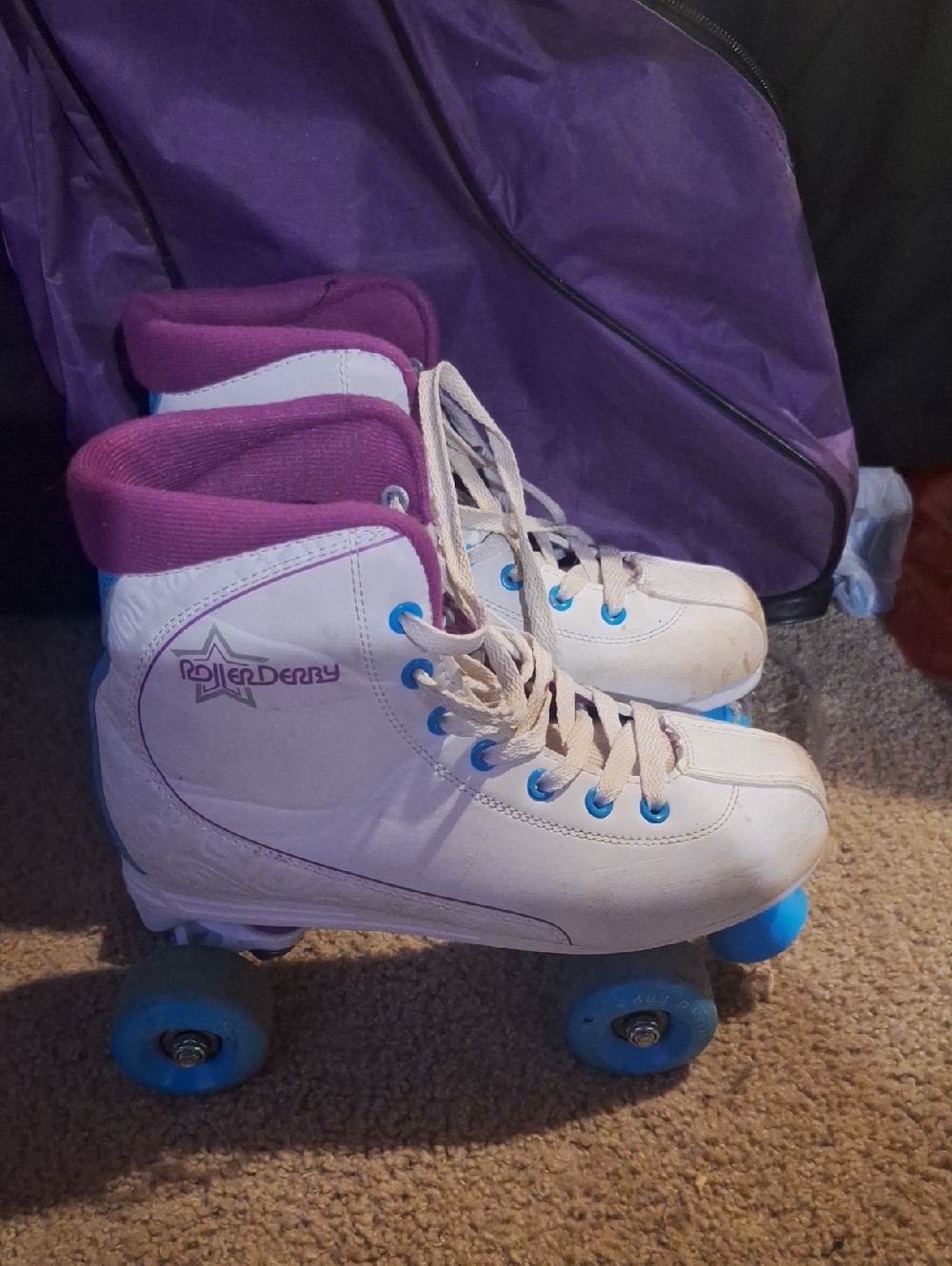 Roller Derby Women's White and Purple Quad Roller Skates, Comes With The Bag.